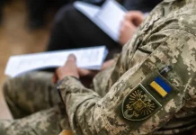 Unannounced inspections are being carried out at TCCs across Ukraine A member of the TCC is processing documents