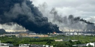 An oil refinery with oil storage tanks