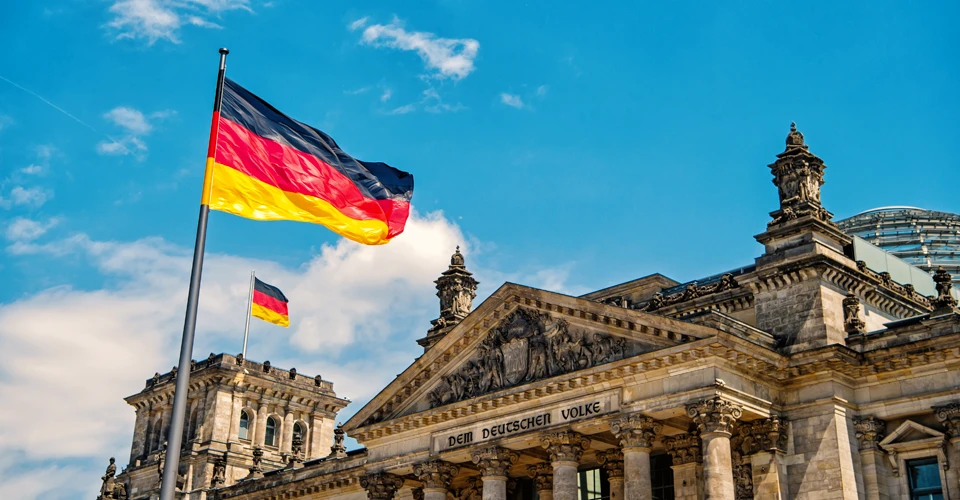 Warning from the Federal Republic of Germany The German flag outside the Reichstag building in Berlin