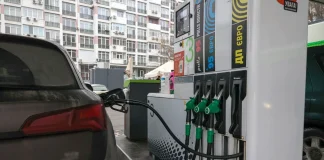 The car is being refuelled at a petrol station
