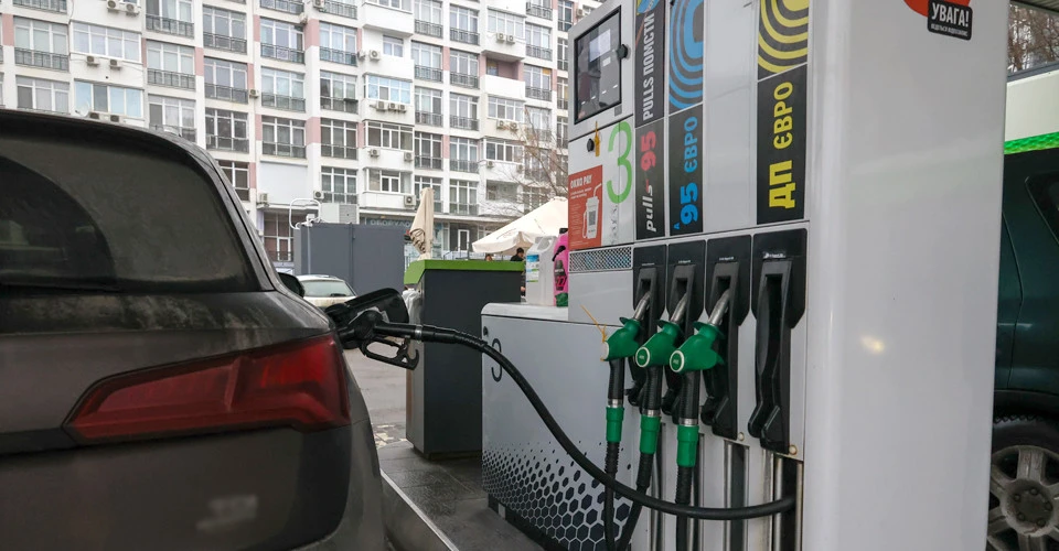 A car at a petrol station The car is being refuelled at a petrol station