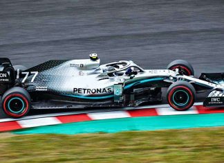 The FIA has reinstated national colours for Russian and Belarusian drivers A Formula 1 car on the race track