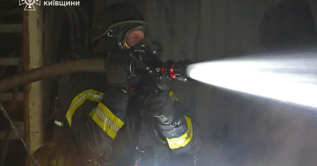 fire in the Bucha district A rescue worker is clearing up the aftermath of the Russian attack in the Kyiv region