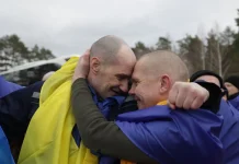 Ukrainian defenders on their return from Russian captivity