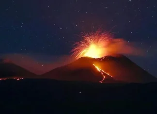 Mount Etna in Sicily during an eruption, with ash plumes