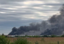 Thick black smoke over the industrial area near the Wildberries hub in Khryastiv