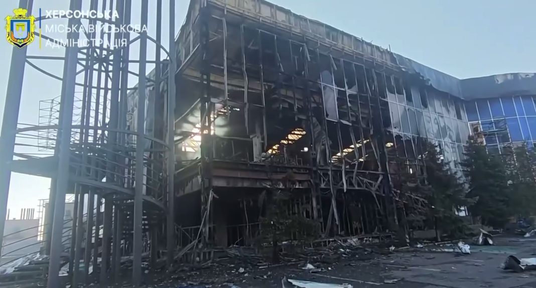A burnt-out façade The charred façade of a shopping centre in Kherson following an attack by Russian drones