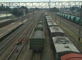 A Ukrzaliznytsia freight train is transporting industrial raw materials