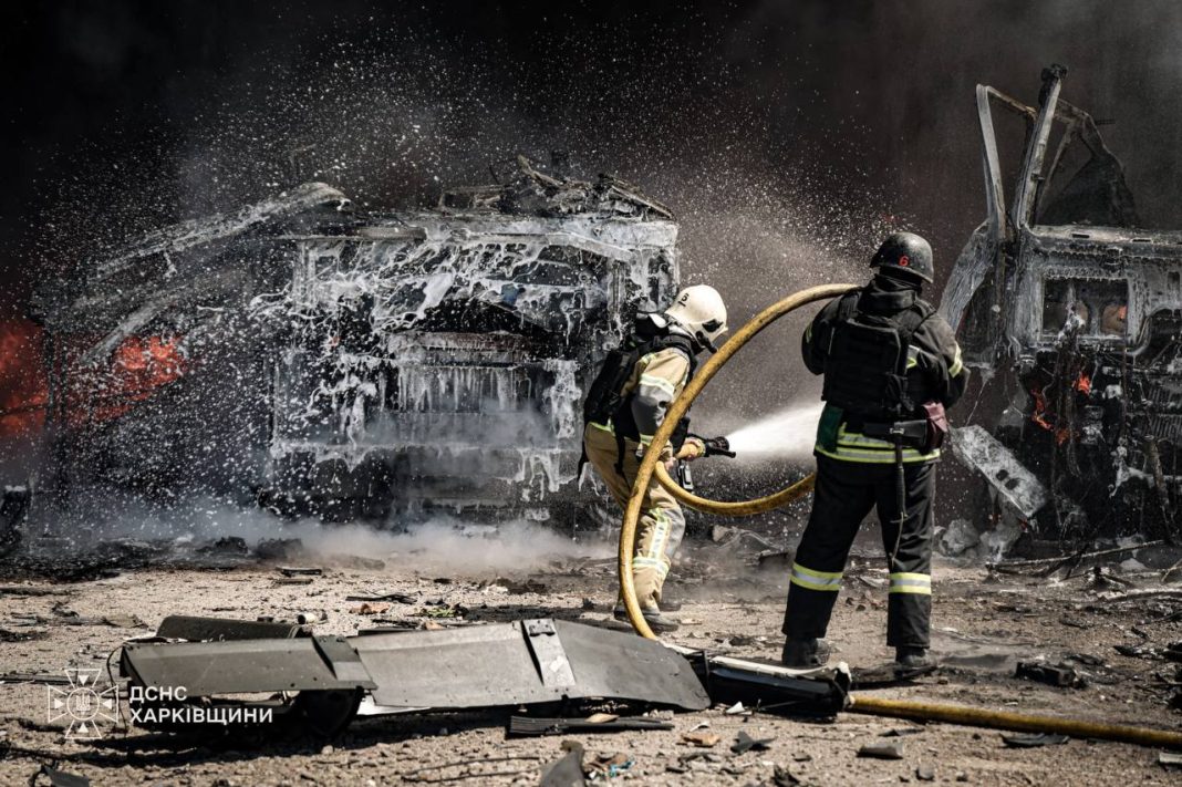 Rescue workers are putting out a fire following a Russian drone attack in the Pisochyn community