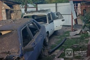Damaged cars and buildings following the Russian attack in the Kharkiv region