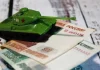 Дефіцит бюджету РФ сягнув 6,46 трлн рублів за сім місяців Російські рублі та іграшковий танк на тлі дефіциту бюджету РФ