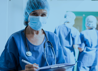 A healthcare worker in a hospital corridor