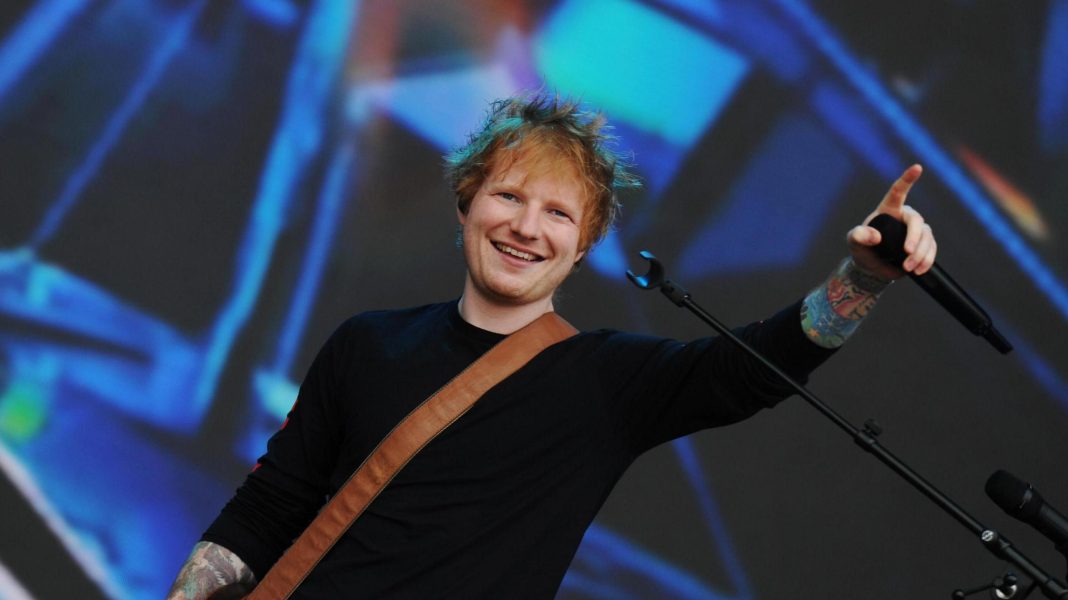 Ed Sheeran performs on stage during a concert Ed Sheeran performs on stage during a concert
