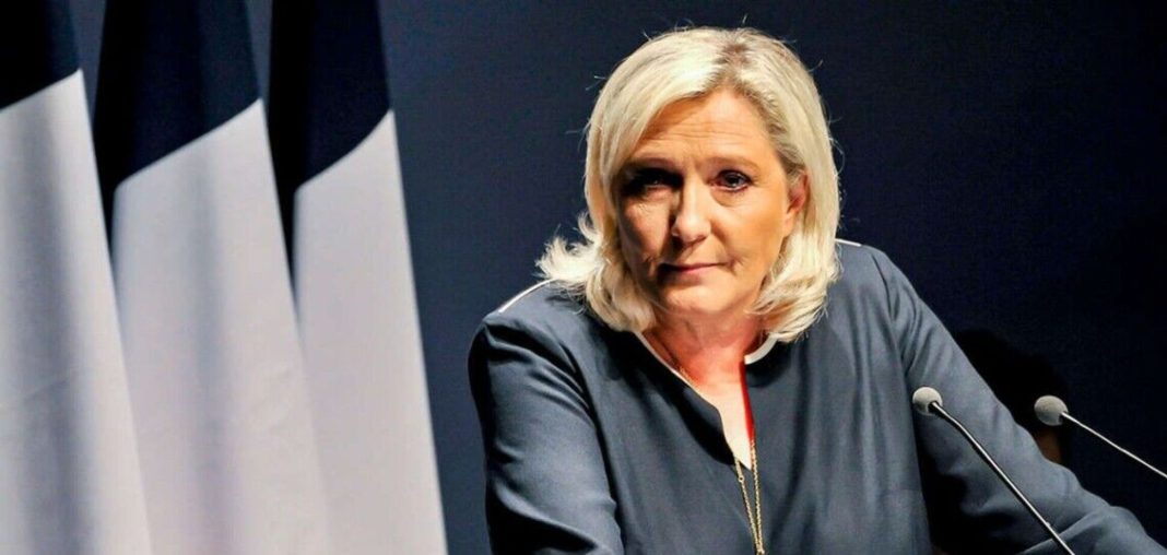 Marine Le Pen Marine Le Pen speaks in front of French flags