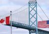 Торгова війна США і Канади загострюється: Оттава ввела мита до 50% Прапори Канади та США на тлі торговельного конфлікту
