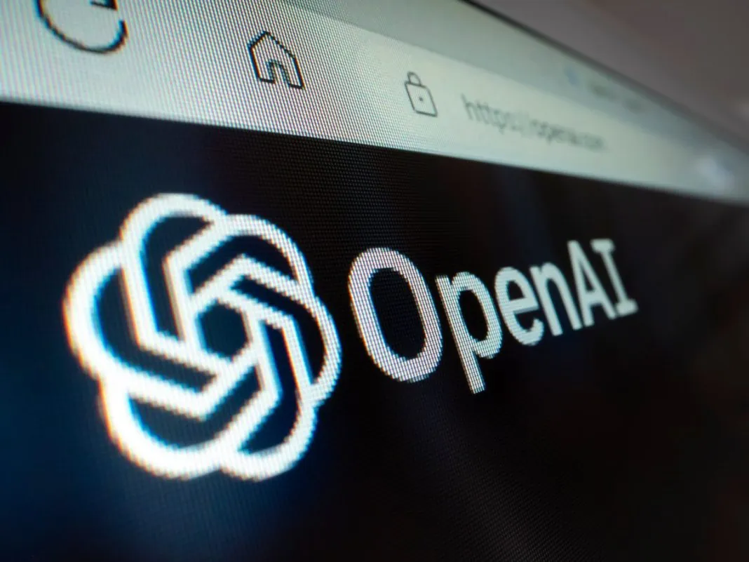 Логотип OpenAI на екрані поруч із зображенням вікісторінки