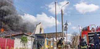 Rescue workers are putting out a fire following a Russian attack on Kramatorsk