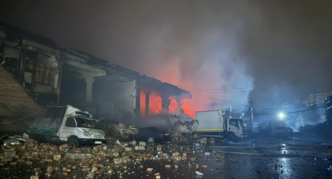 Rescue workers are at the scene of a Russian strike on an agricultural enterprise in the Kharkiv region