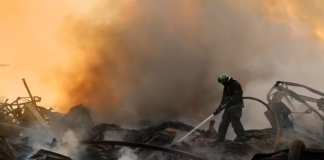 A «Rud» warehouse containing finished goods has been destroyed in Zhytomyr A firefighter is putting out a fire following an explosion at a warehouse in Zhytomyr