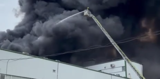 Thick black smoke over a warehouse complex in Odesa following a Russian attack