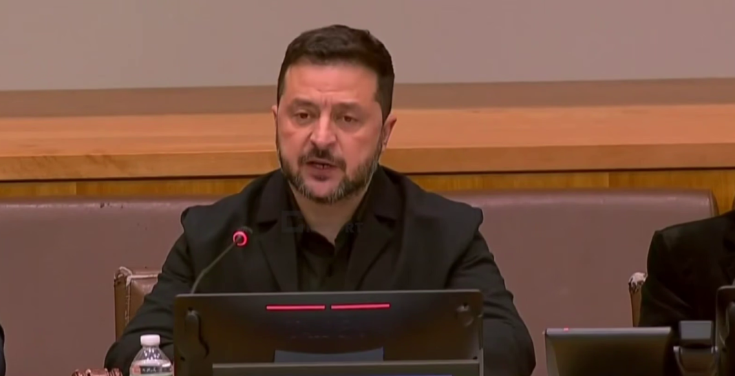 Zelenskyy stated that Ukraine is ready to contribute to the safety of shipping Volodymyr Zelenskyy is speaking at a table with a microphone.