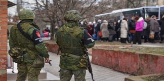 Розвідка попередила про ризик російських провокацій на ТОТ під час голосування Російські військові на тимчасово окупованій території України