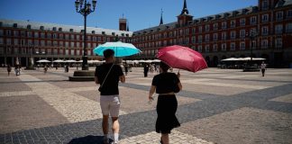 Spain has recorded its hottest September on record, with temperatures reaching 45.7°C People are seeking shelter from the record-breaking heat under parasols in Spain
