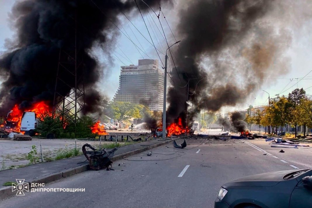 The scene of the attack in Dnipro Firefighters are putting out a fire following an attack in Dnipro