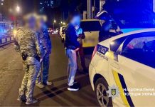 Police at the scene of a road traffic accident near a checkpoint in Odesa
