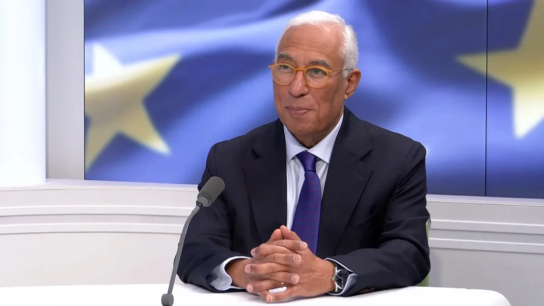 António Costa, President of the European Council, during an interview against the backdrop of the European Union flag.