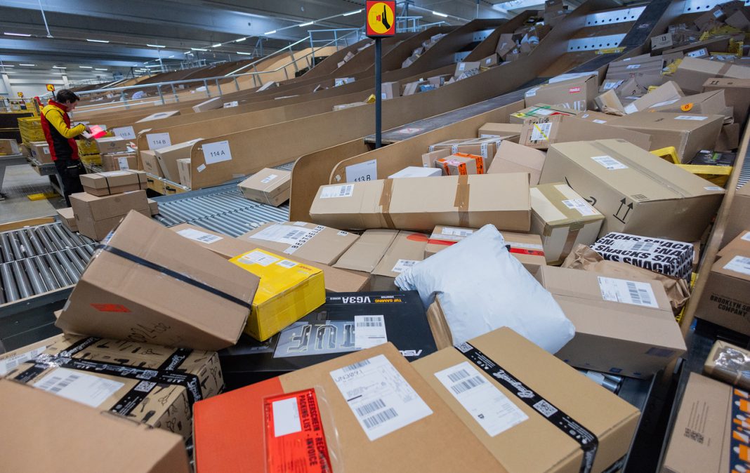 Parcels International parcels and boxes on the sorting line at the logistics centre, prior to delivery to customers.