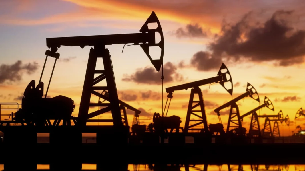 Oil production facilities at sunset