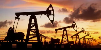Oil production facilities at sunset