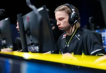 NAVI captain Aleksib Virolainen wearing headphones during a Counter-Strike 2 esports tournament.