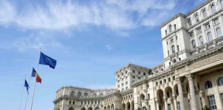 A new government has been approved in Romania following a six-month crisis The Romanian Parliament Building in Bucharest, with the flags of Romania and the European Union flying in front of the main façade.