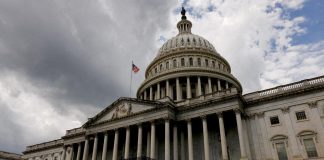The US Congress is trying to block Trump’s oil deal with Putin The dome and colonnade of the US Capitol with the American flag