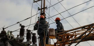 Power company staff are carrying out repairs to electrical equipment at a substation — emergency power cuts in Kyiv and the Kyiv region on 9 October 2026.