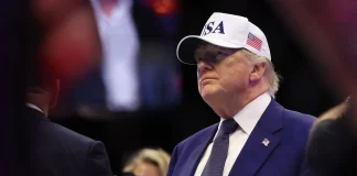 69% виборців США стурбовані ризиками в адміністрації Трампа Дональд Трамп в кепці USA