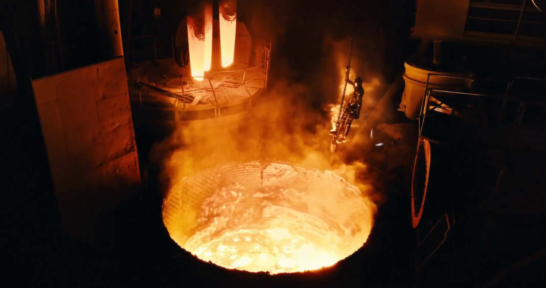 F-02 robot The Figure AI robot standing over a furnace containing molten steel during the scrapping of F.02