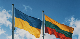 The Baltic states have called on the EU to ban the transit of Russian grain The flags of Ukraine and Lithuania are flying from the flagpoles