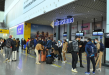 A Ukrainian woman has been detained in Kazakhstan following a request for her extradition from Russia Passengers with luggage in the check-in area at Astana International Airport