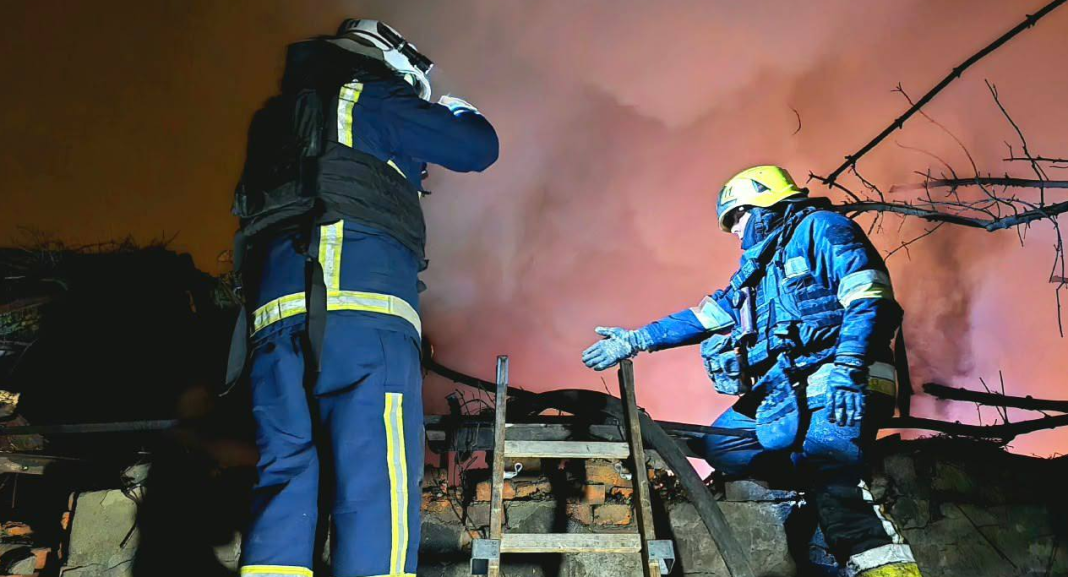 Rescue workers from the State Emergency Service are working at the scene of the fire amongst the rubble during the night