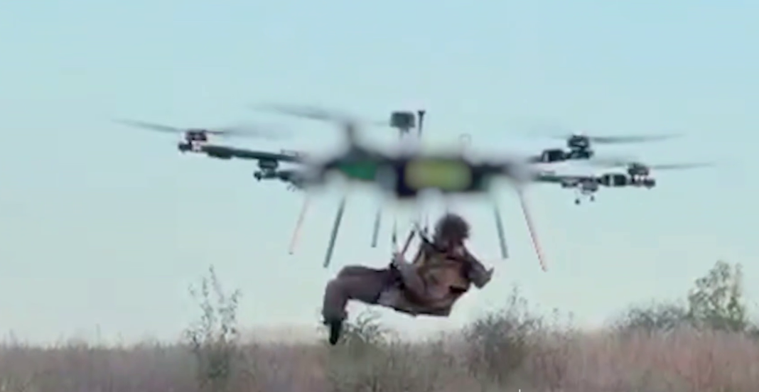 A hexacopter is transporting a soldier A heavy hexacopter is transporting a person