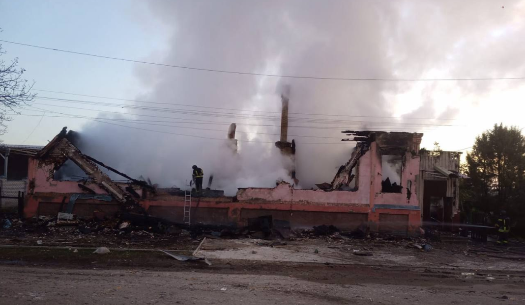 A building in Izium, in the Kharkiv region, destroyed by fire following a Russian drone attack on 20 October 2026; rescue workers are at work amongst the ruins.