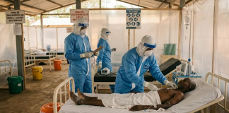 Healthcare workers in protective suits during operations to combat the spread of the Ebola virus in Africa.
