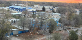 Damaged buildings and debris on the site of the "Marshal" industrial complex"
