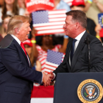A scandal has erupted in Germany over the Audi chief’s appearance with Trump