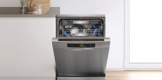 A Bosch dishwasher with open baskets in a modern kitchen