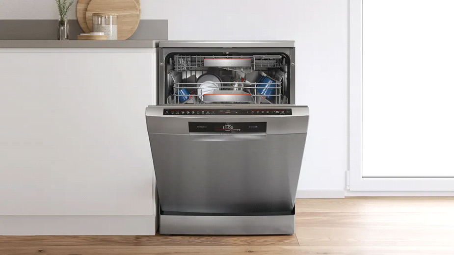 Bosch dishwasher A Bosch dishwasher with open baskets in a modern kitchen