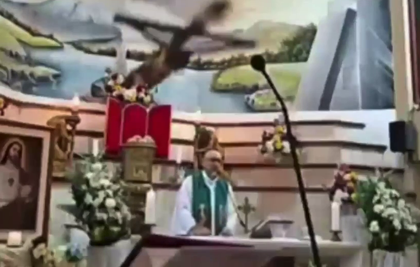Guayaquil The moment a large wooden cross fell on a priest during a service at a church in Guayaquil, Ecuador.